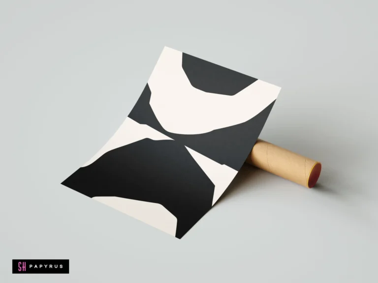 Minimalist black and white abstract wall art print featuring organic bold shapes leaning against a cardboard mailing tube on a neutral background.