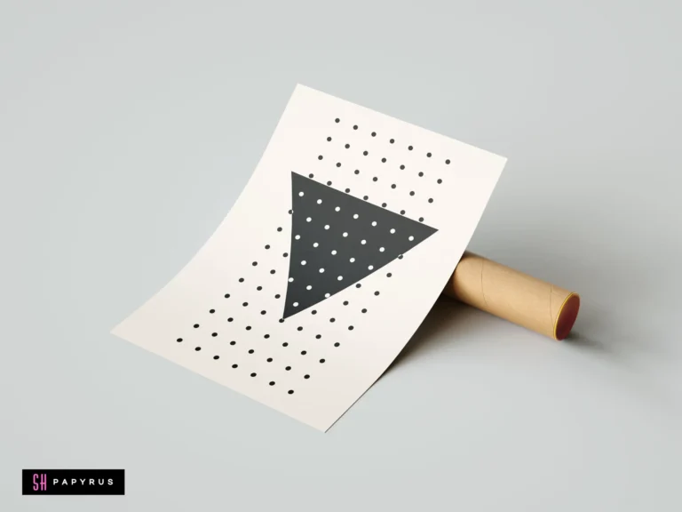 Minimalist black geometric triangle wall art print with polka dots on white background, leaning against a cardboard mailing tube.