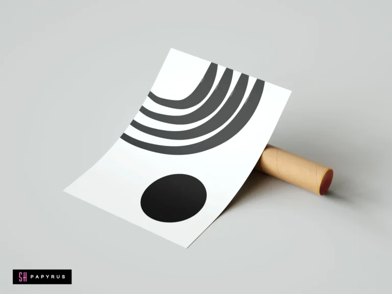 Minimalist monochrome wall art print featuring black geometric arches and a solid circle on white paper, resting against a cardboard mailing tube.