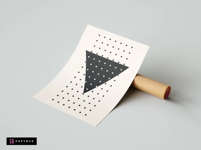 Modern minimalist wall art featuring a bold black triangle and geometric polka dot pattern on a cream background, shown propped against a mailing tube.