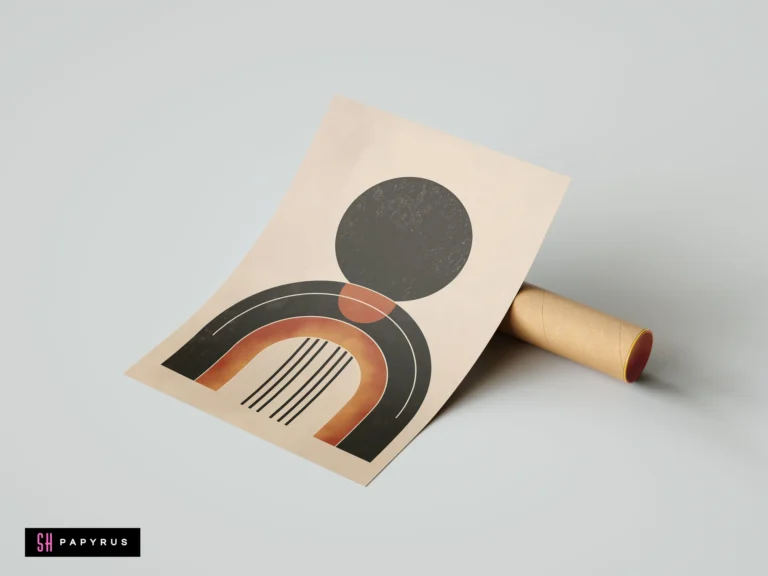 Minimalist geometric wall art print featuring a black sun and terracotta arch in earthy tones, resting on a cardboard mailing tube.