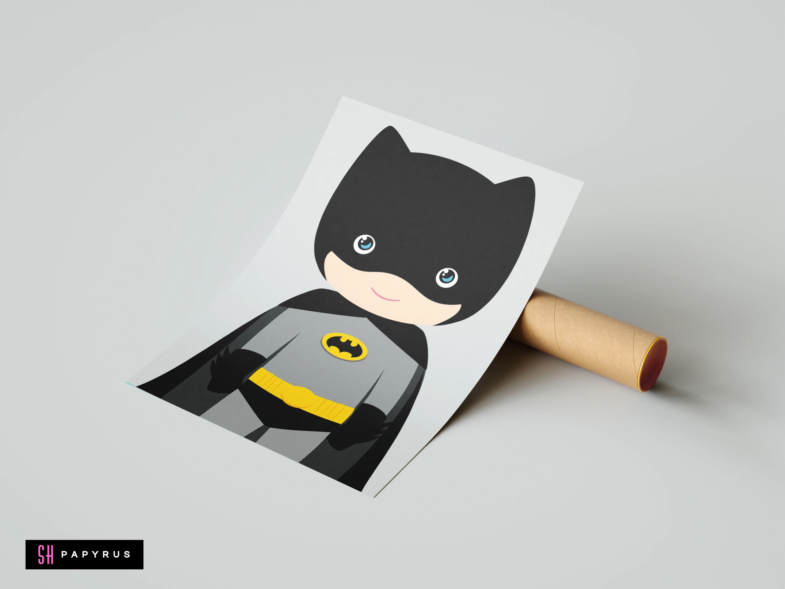 Chibi Batman artwork in grey and black on a poster leaning against a tube.