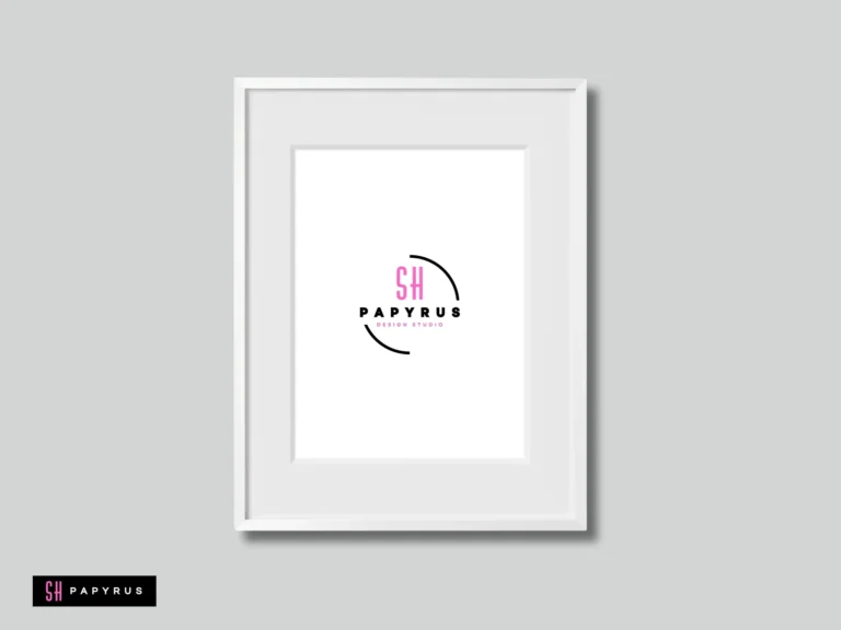 Minimalist pink and black logo displayed in a sleek white oak wood picture frame.