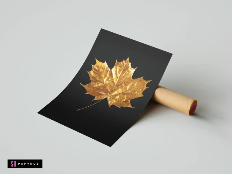 Minimalist art print featuring a textured gold maple leaf on a black background.