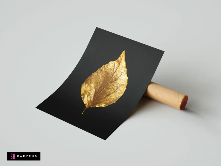 Minimalist macro nature art featuring a detailed textured golden leaf on a black background.
