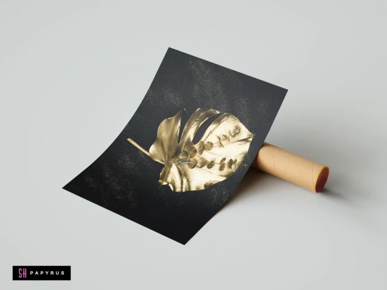Golden tropical monstera and eucalyptus leaves on a minimalist black background with gold speckles.
