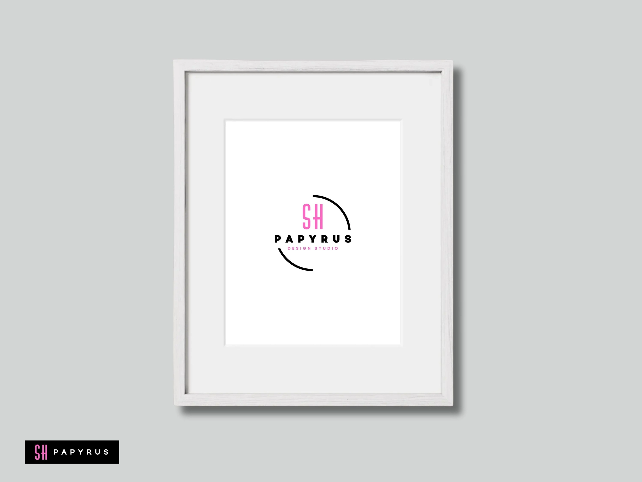 Modern minimalist white framed wall art with a pink and black design studio logo.