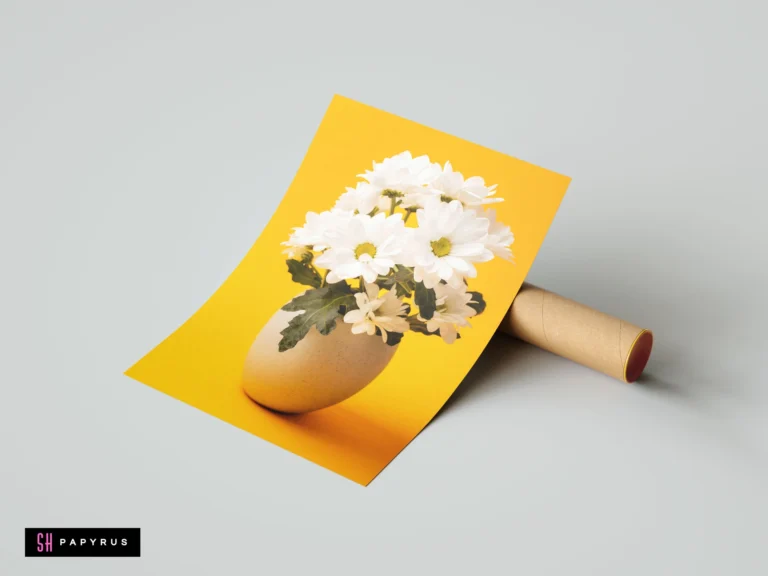 Minimalist wall art showcasing white flowers in an eggshell against a vibrant yellow background.